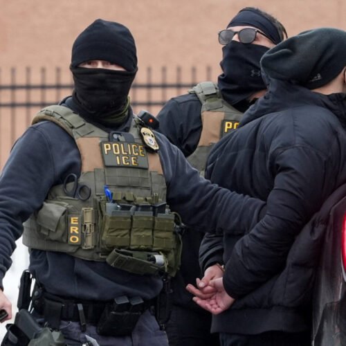 Members of U.S. Immigration and Customs Enforcement (ICE) detain an observer, who was later released, as part of U.S. President Donald's Trump's immigraton policy, in Minneapolis, Minnesota, U.S., January 6, 2026.  REUTERS/Tim Evans